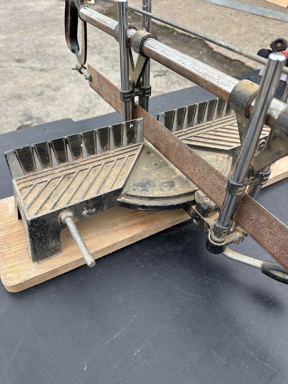 Lot 115: A Manual Precision Mitre Saw and Stand Mounted on Board
