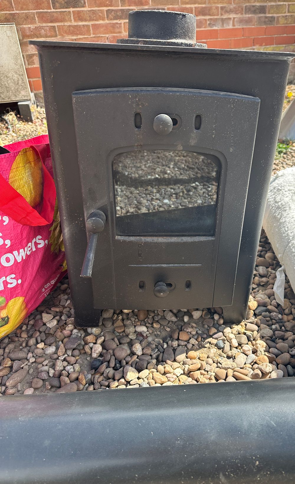 Lot 137: A Multi-Fuel Stove and Associated Flue Components