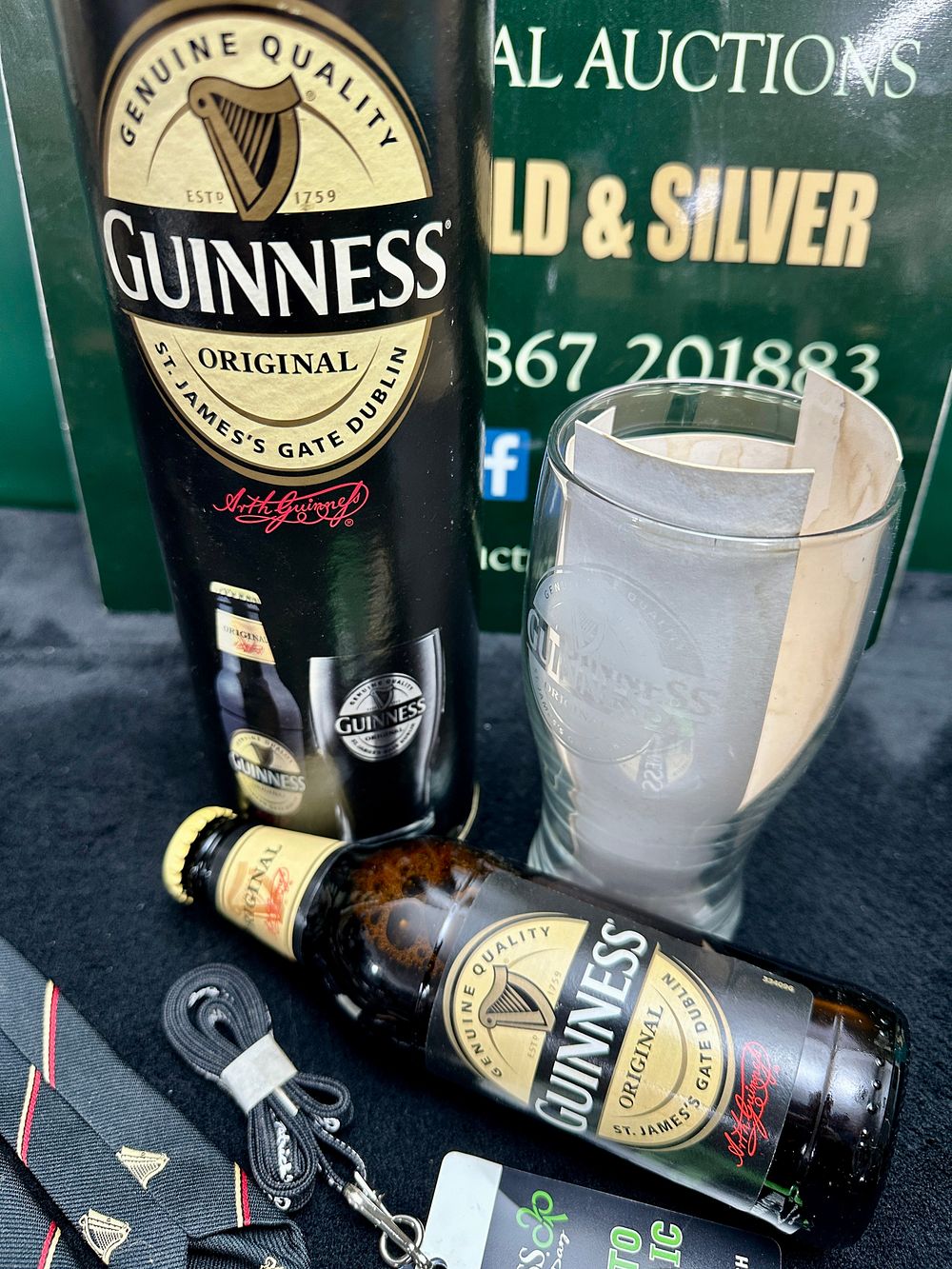 Lot 143: A Guinness Branded Set Including Glassware, Original Stout, and Accessories
