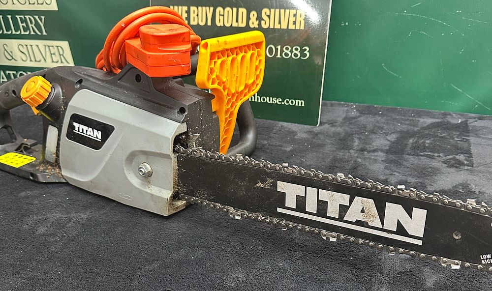 Lot 147: A Titan TTL758CHN-A Corded Electric Chainsaw with 405 mm Bar