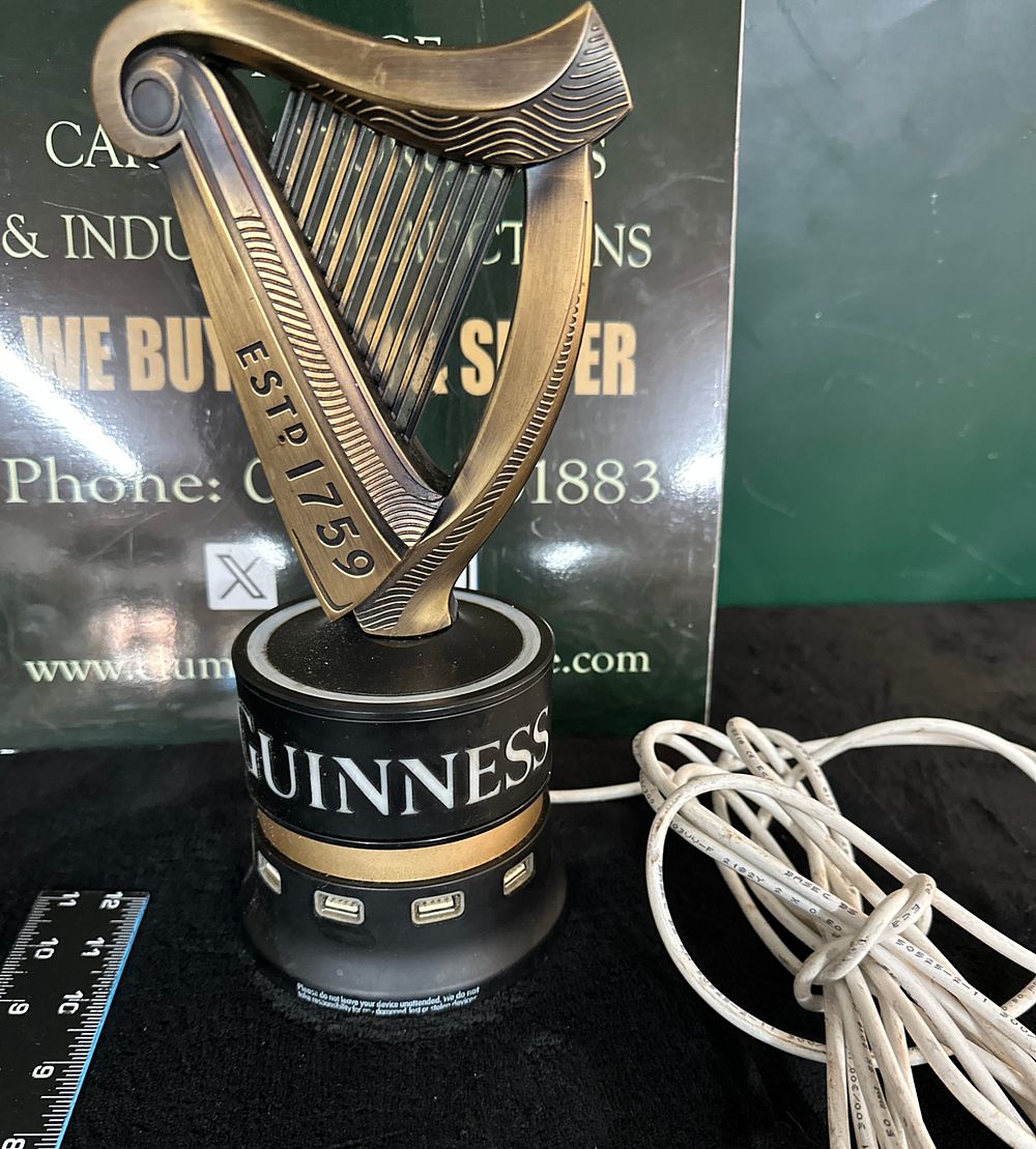 Lot 148: A Guinness Bar-Top USB Charging Hub with Harp Figure