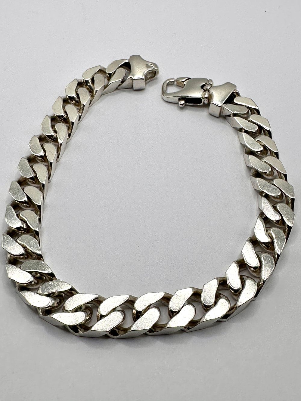 Lot 209: A 925 Stirling Silver Curb Link Bracelet