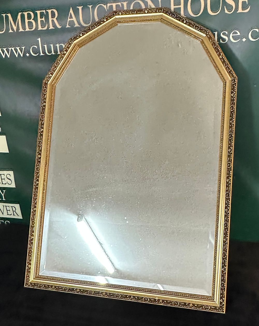 Lot 159: A Beveled Wall Mirror with Arched Casket Top