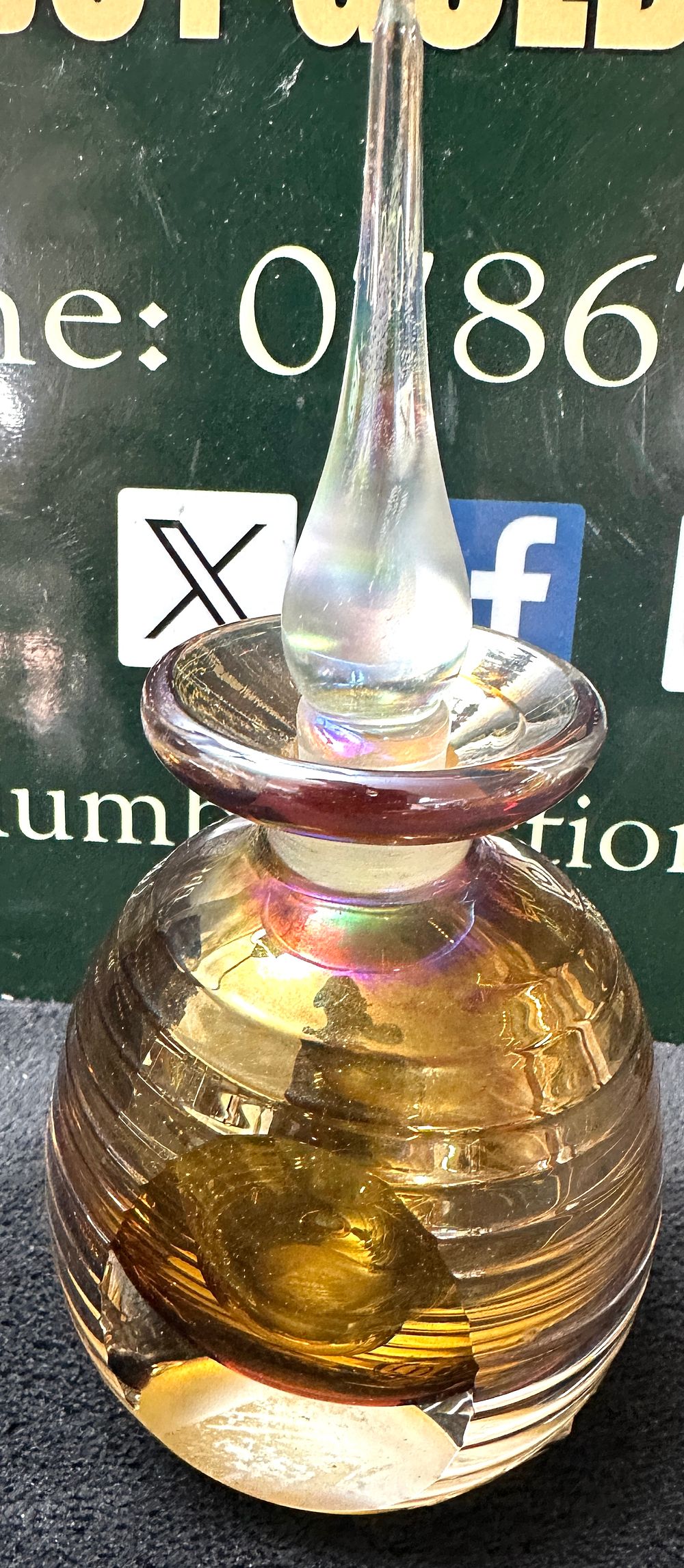 Lot 68: An Iridescent Glass Perfume Bottle with Tapered Stopper
