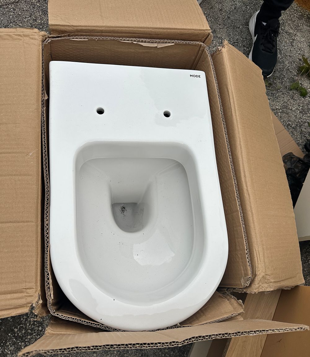 Lot 94: A White Ceramic Mode Wall-Hung Toilet Pan