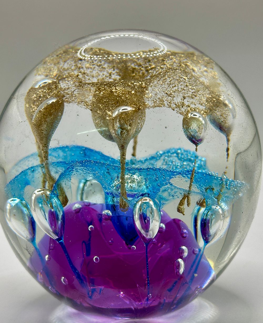 Lot 284: A Selkirk Caithness Glass Paperweight with Gold Aventurine and Controlled Bubbles