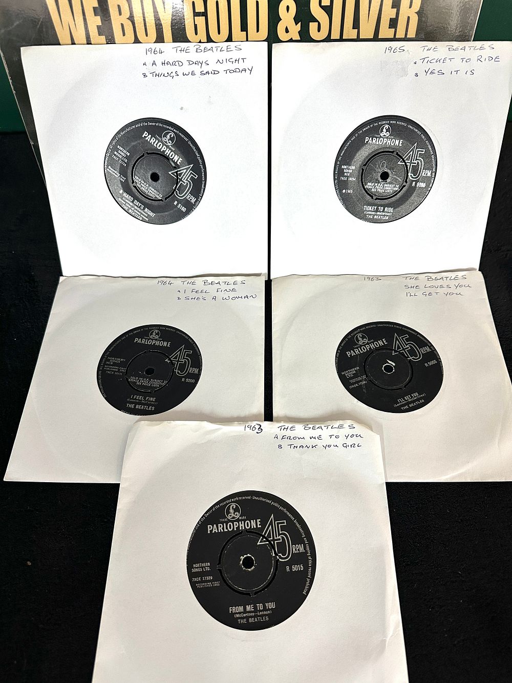 Lot 290: An Assortment of Five 1963-1965 The Beatles UK Parlophone 7-Inch Singles
