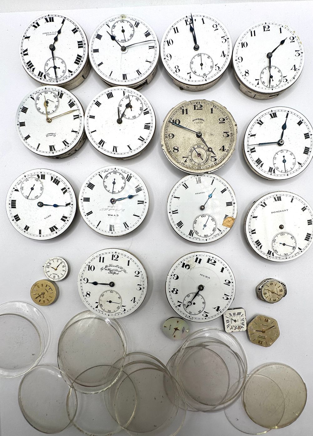 Lot 230: A Collection of Pocket Watch and Wristwatch Movements, Dials, and Crystals