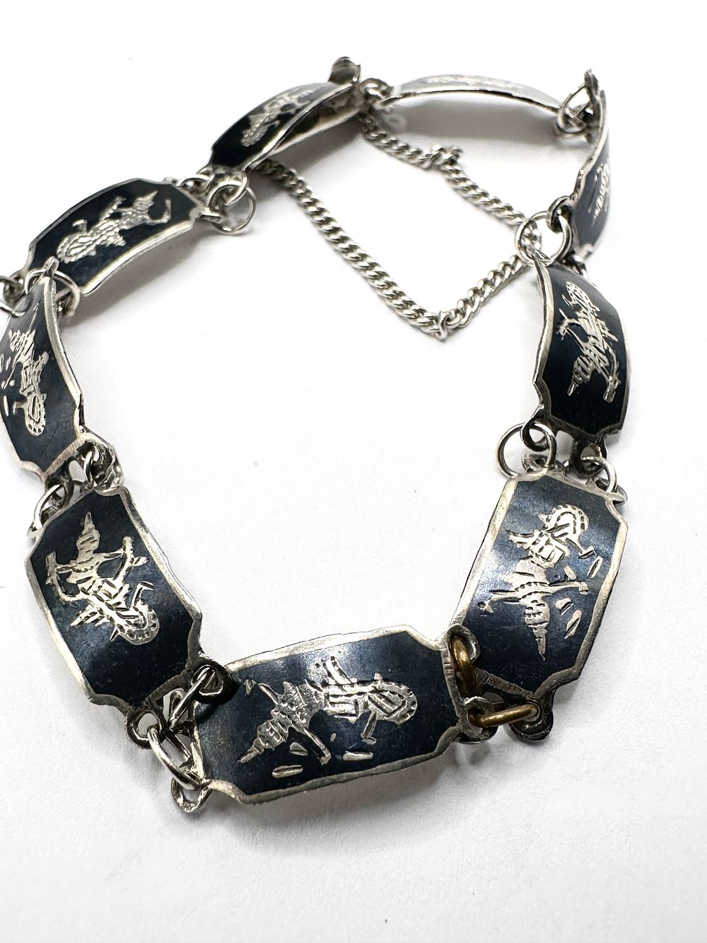 Lot 249: A Mid-20th Century Sterling Silver Niello Link Bracelet