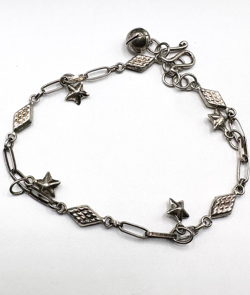 Lot 251: A Silver Charm Bracelet With Star And Bell Motifs