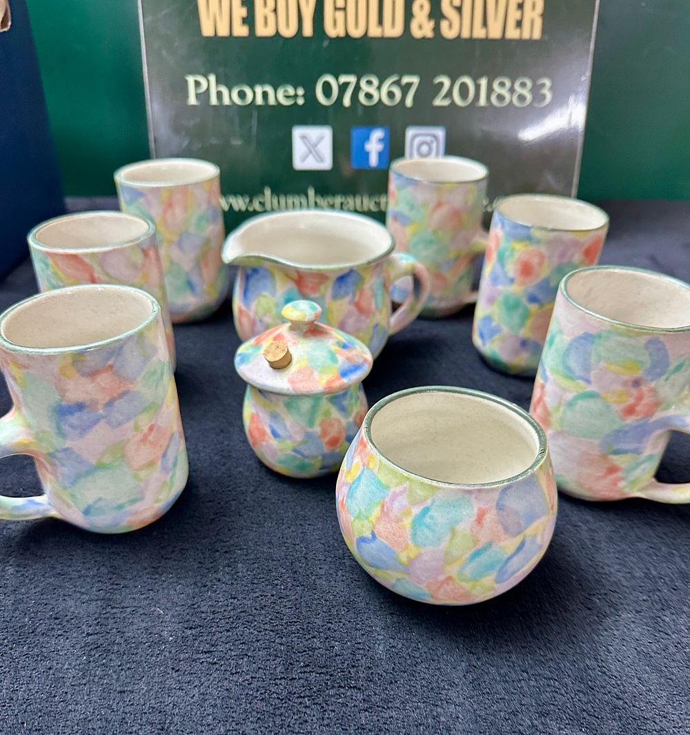 Lot 81: A Nine-Piece New Zealand The Creek Pottery Tea Service