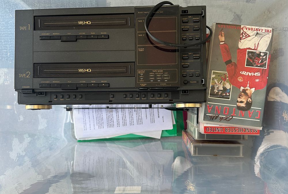 Lot 334: A Dual-Deck VHS Video Cassette Recorder with Manchester United Tapes