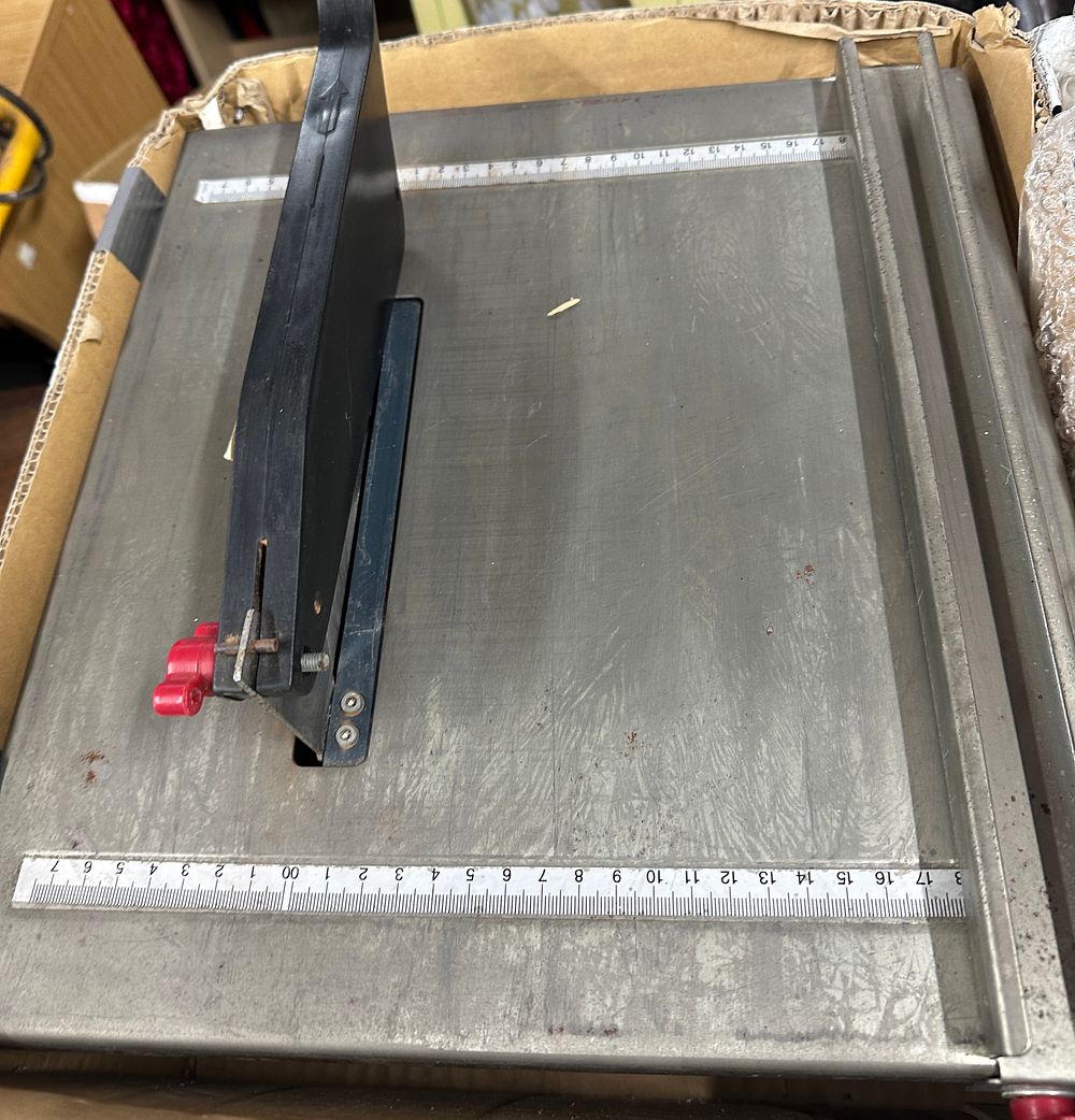 Lot 341: A Rock Electric Wet Tile Cutter with Original Packaging