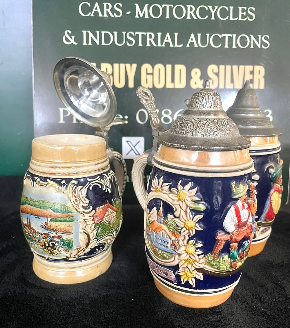 Lot 24: Three German Relief-Molded Ceramic Beer Steins