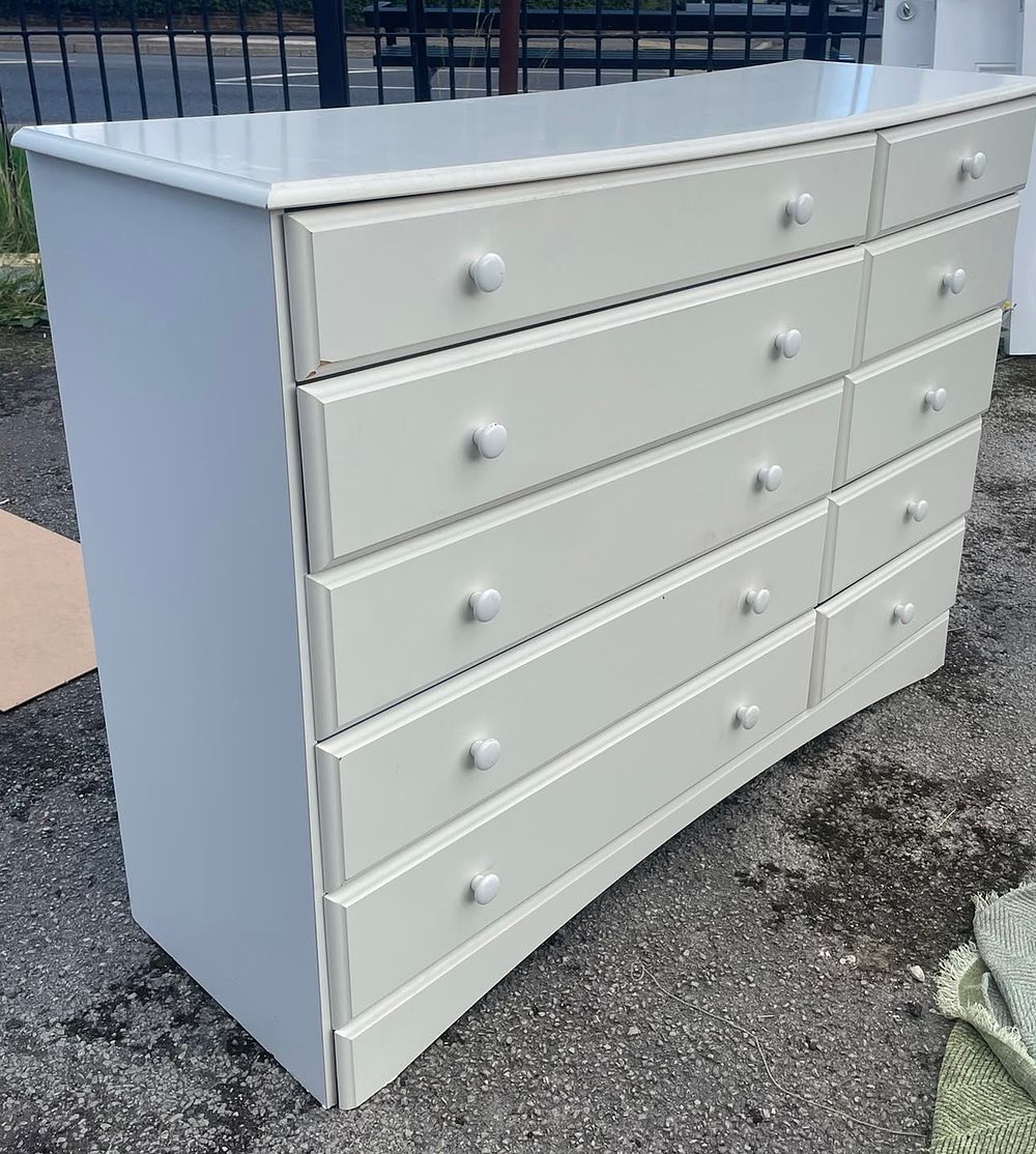 Lot 33: A Contemporary Multi-Drawer Chest With Thirteen Drawers And Beveled Fronts
