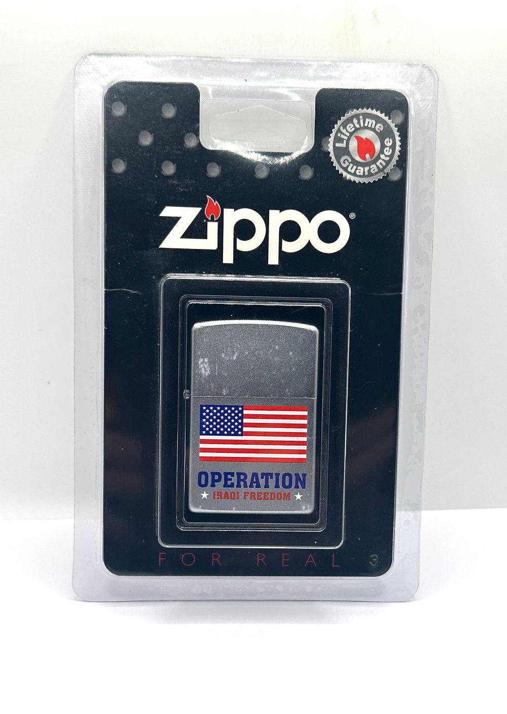 Lot 261: A Zippo Operation Iraqi Freedom Windproof Lighter In Original Packaging