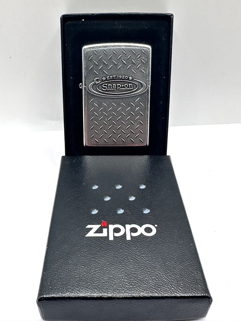 Lot 263: A Zippo Snap-on Wrench Diamond Plate Lighter and Cases