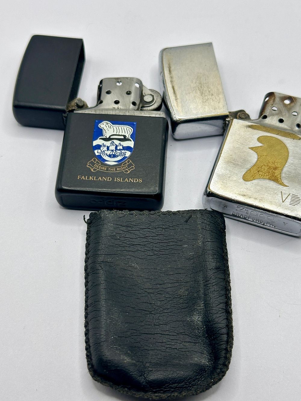 Lot 268: Two 1989 and 1995 Zippo Pocket Lighters, Falkland Islands and V Commemorative