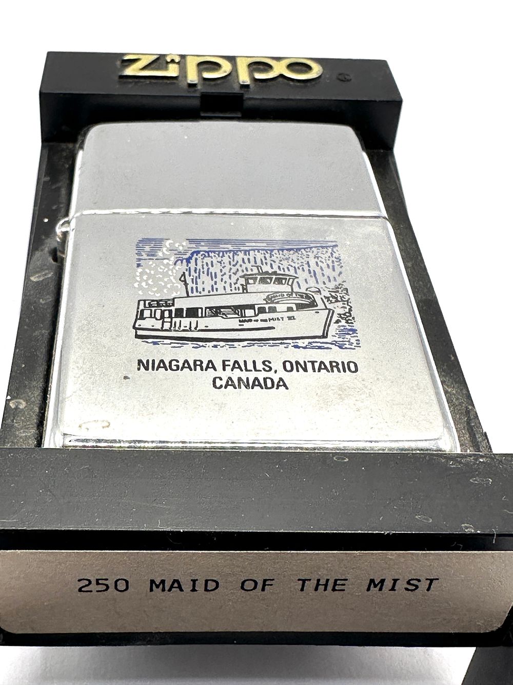 Lot 270: A Zippo Maid of the Mist Souvenir Lighter and Display Box