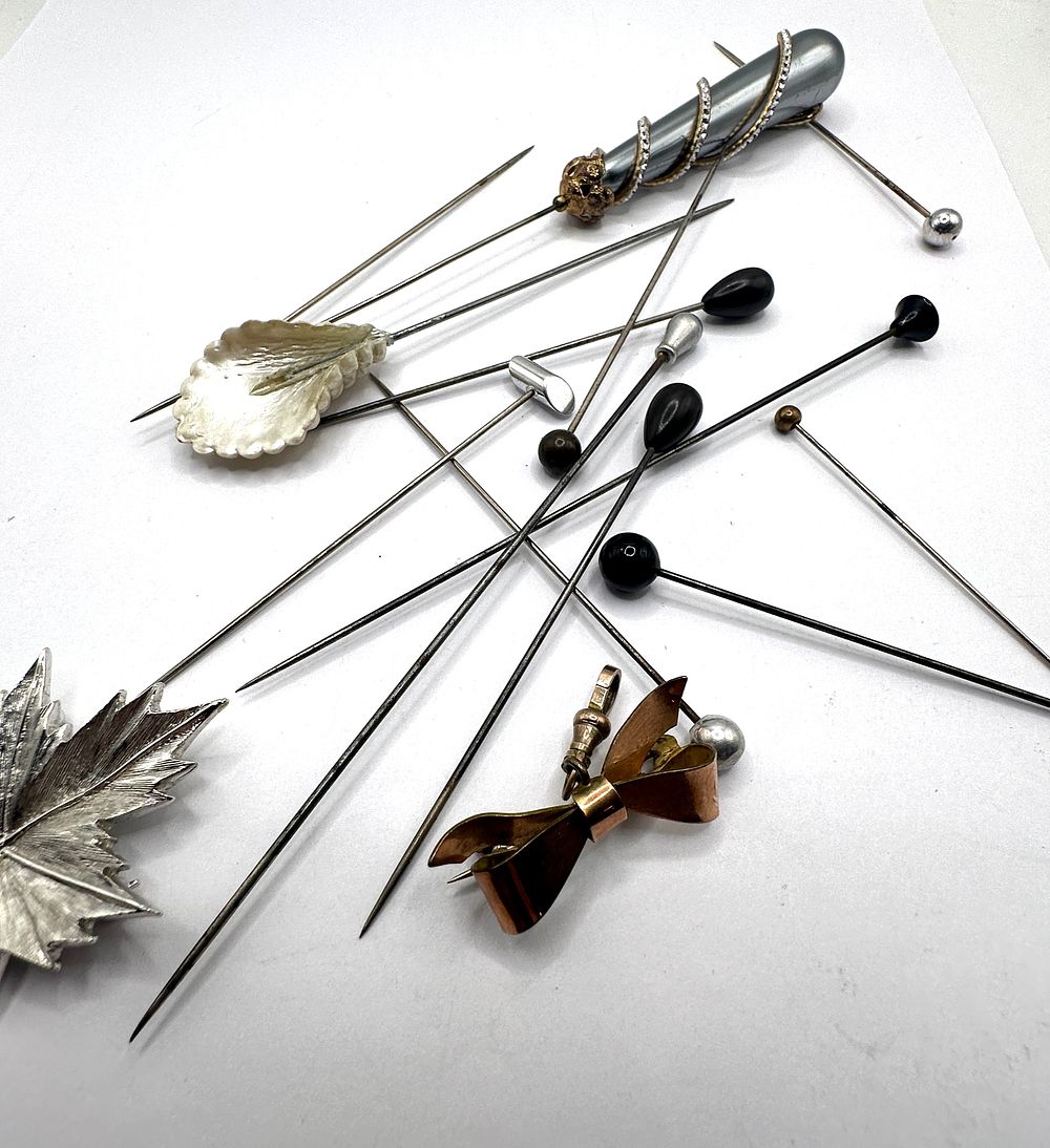 Lot 184: A Collection of Antique and Vintage Hatpins and Stickpins