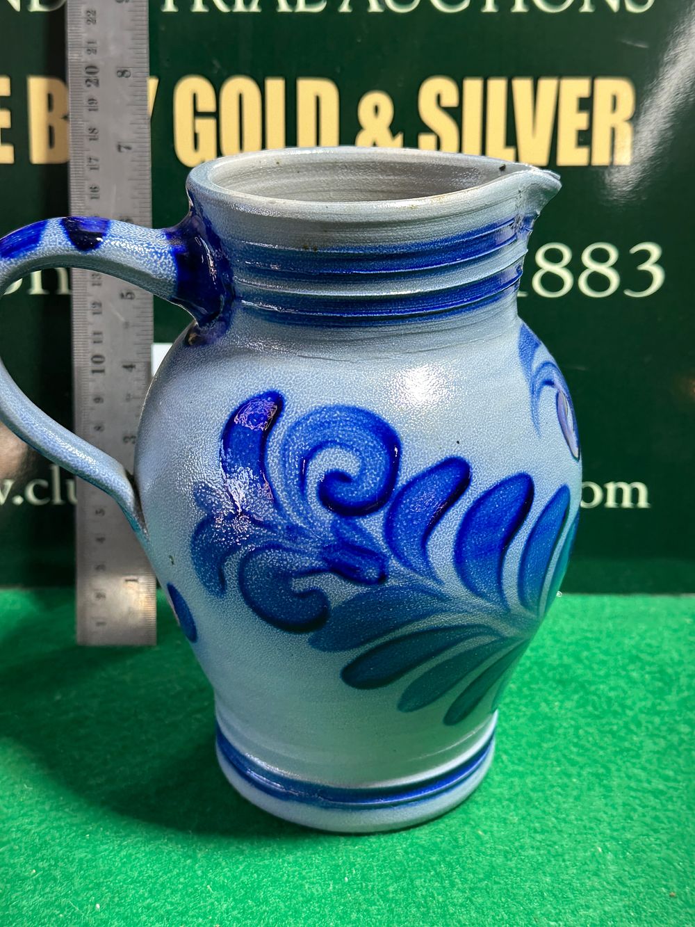 Lot 187: A Salt-Glazed Stoneware Pitcher with Cobalt Decoration