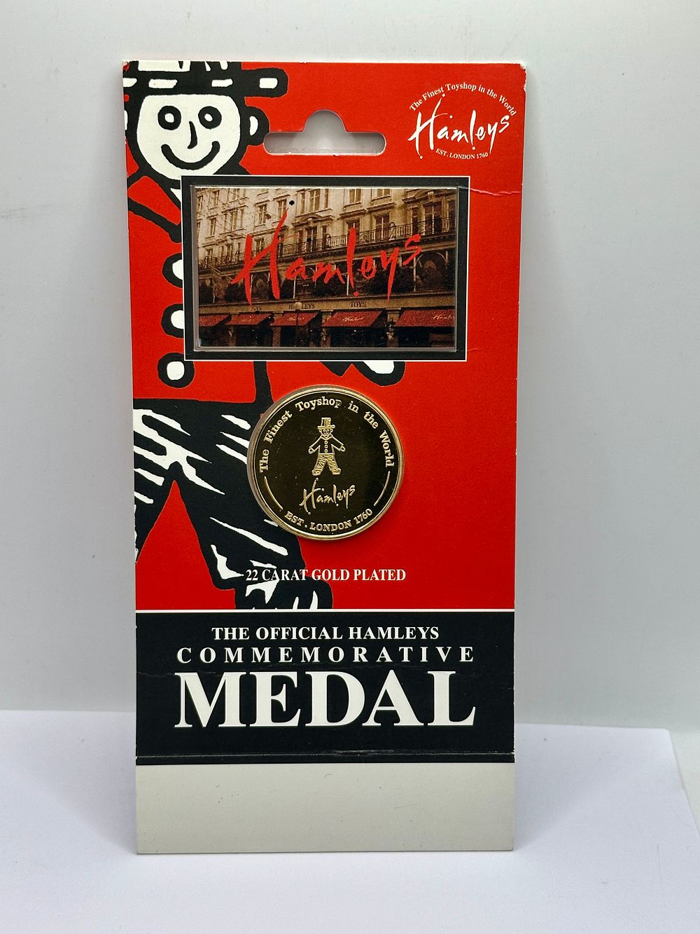 Lot 18: A Hamleys Official Commemorative Medal, 22 Carat Gold Plated