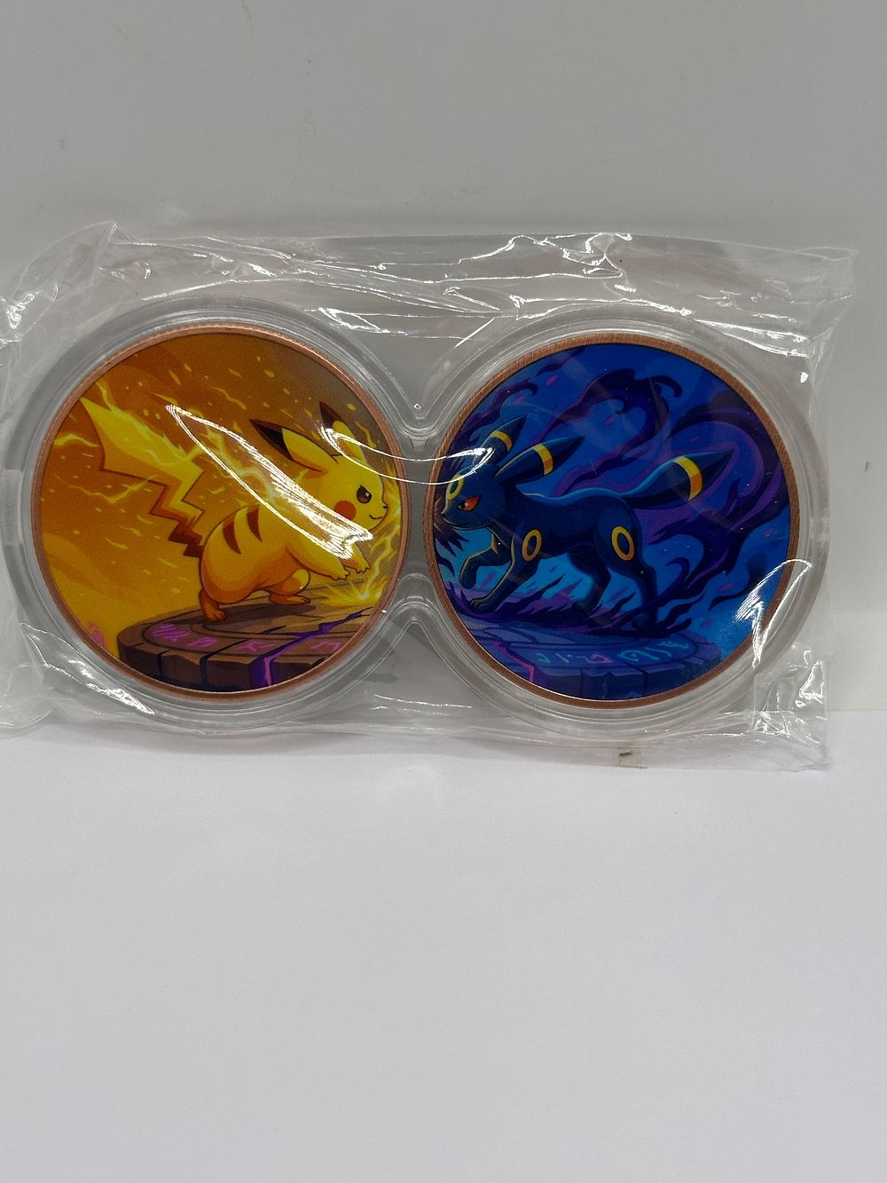 Lot 83: Two Pokémon Collectible 1 oz 999 Copper , Umbreon and Pikachu