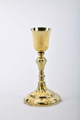 A chalice. gilt silver gadrooned stem and foot, inscription inside the foot. Indo-Portuguese 