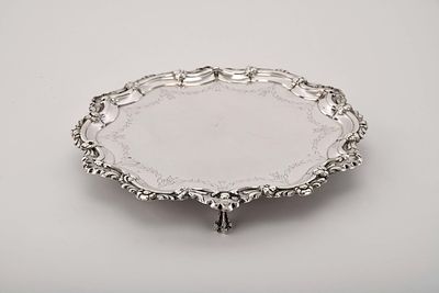 A scalloped salver wit three feet. D. Jos&eacute; I, King of Portugal (1750-1777)/D. Maria I, Queen of 