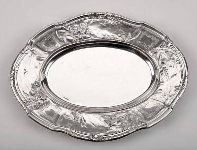 A scalloped oval platter with container. 950/1000 silver flap with decoration en relief "Fish 