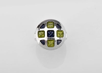 A CARTIER ring. 750/1000 gold PASHA model, set with iolites and peridots Italian 21st C. Turin's 