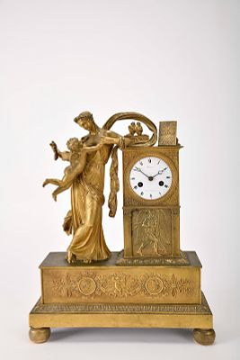A table clock - "Allegory of love and friendship". Empire gilt bronze en relief 