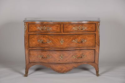 A Commode. Louis XV style mahogany and Brazilian rosewood marquetry pierced and gilt bronze 