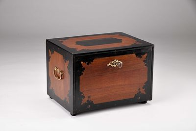 A travel bureau. teak partial and inlaid ebony veneer, interior with five drawers, the central 