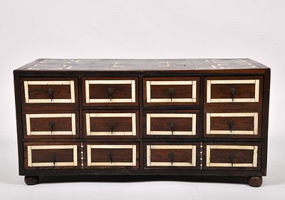 A platform cabinet with eight drawers simulating twelve. mannerist wood fully coated with 