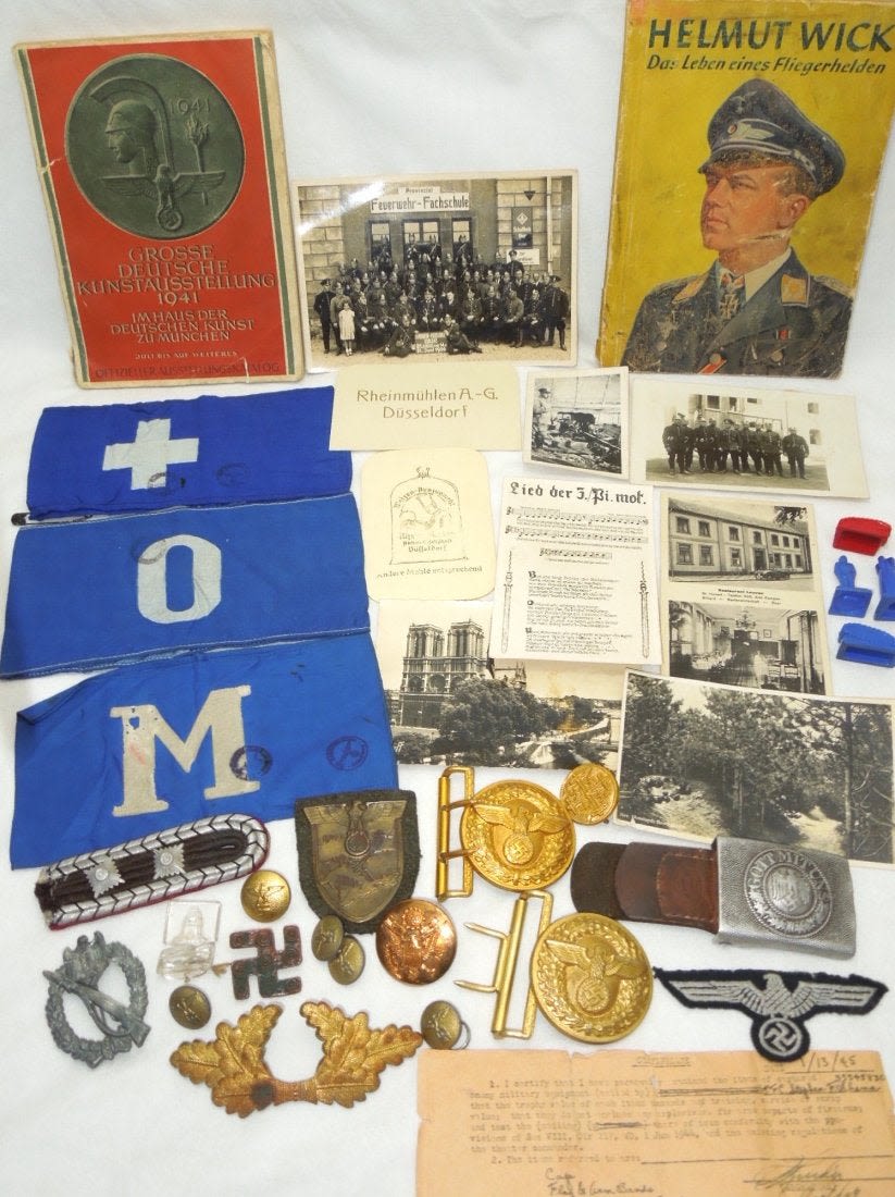 Lot 250A: WWII 79th Infantry German Souvenir Bring Backs Badges