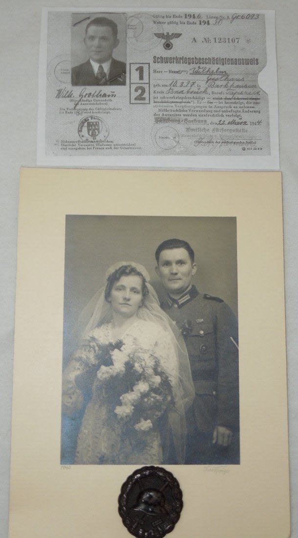 Lot 251: WWI German Army Wound Badge & 1940 Soldier Photo Named