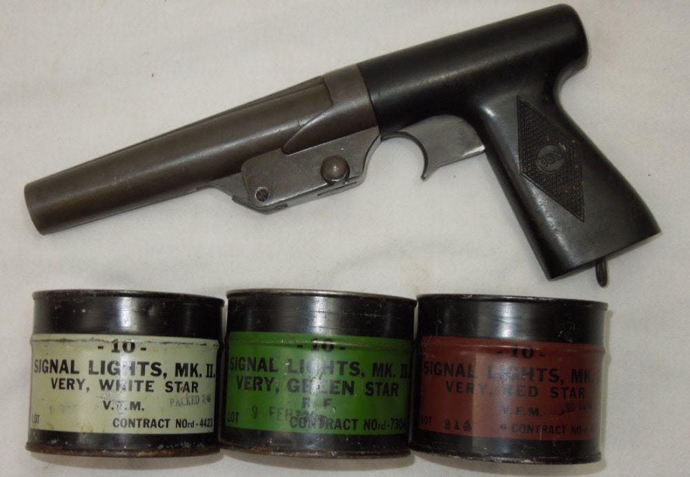 Lot 297: WWII US Navy Flare Gun and Signal Flares in Cans