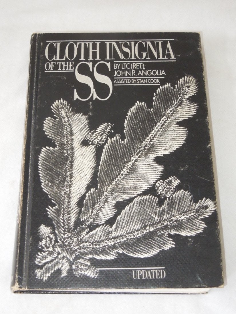 Lot 510: Cloth Insignia of the SS Book Angolia