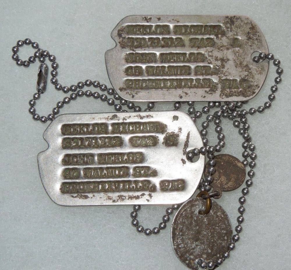 Lot 275: WWII US Army Wounded In Action NOK Dog Tags Set