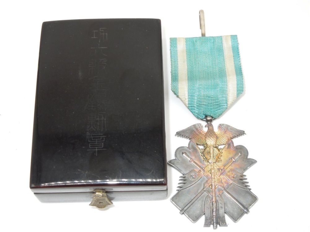 Lot 309: Japanese Order of the Golden Kite 7th Class Badge Medal & Rosette with Case of Issue