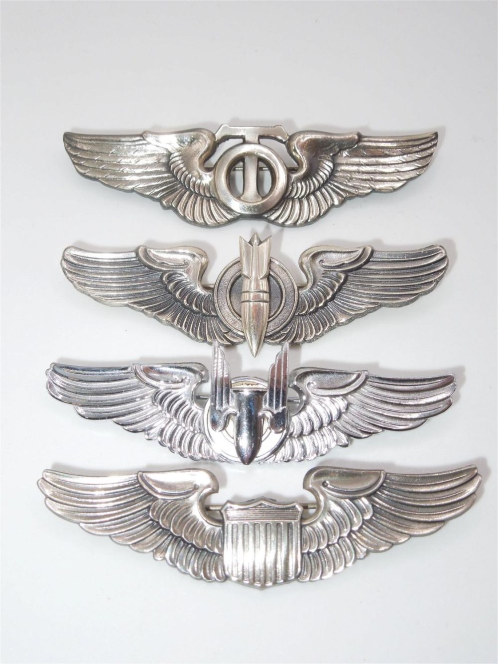 Lot 470: Lot of Reproduction WWII USAAF Sterling Marked Wing Pins