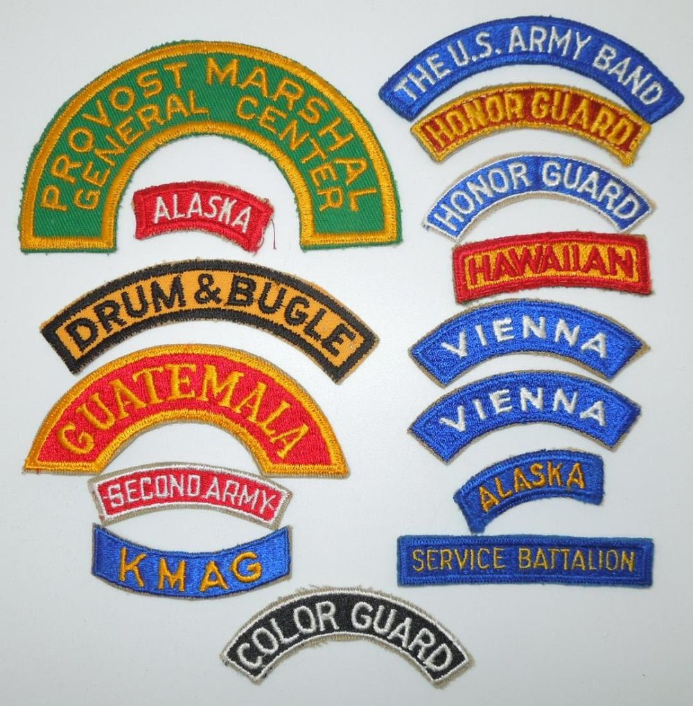 Lot 188: WWII - 1950s US Army Tabs Scrolls Patches Provost Marshal Alaska