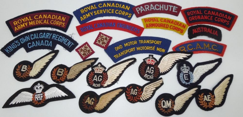 Lot 204: WWII - Post War British & Canadian RCAF Army Shoulder Titles Wings Lot