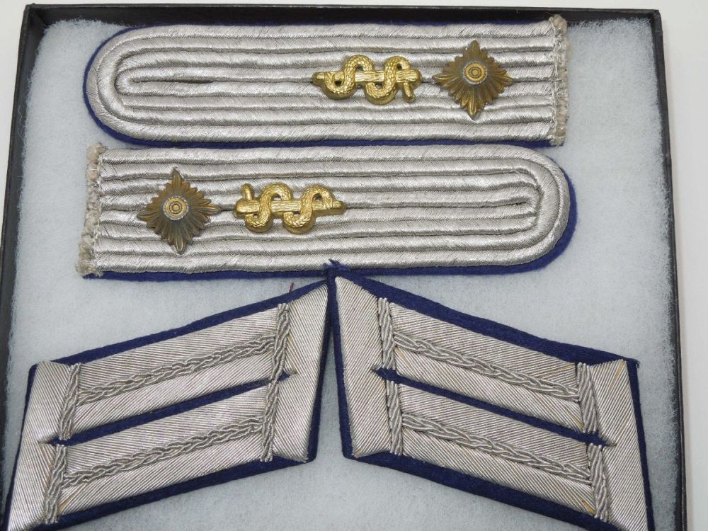 Lot 206: WWII German Medical Officer Collar Insignia & Shoulder Boards
