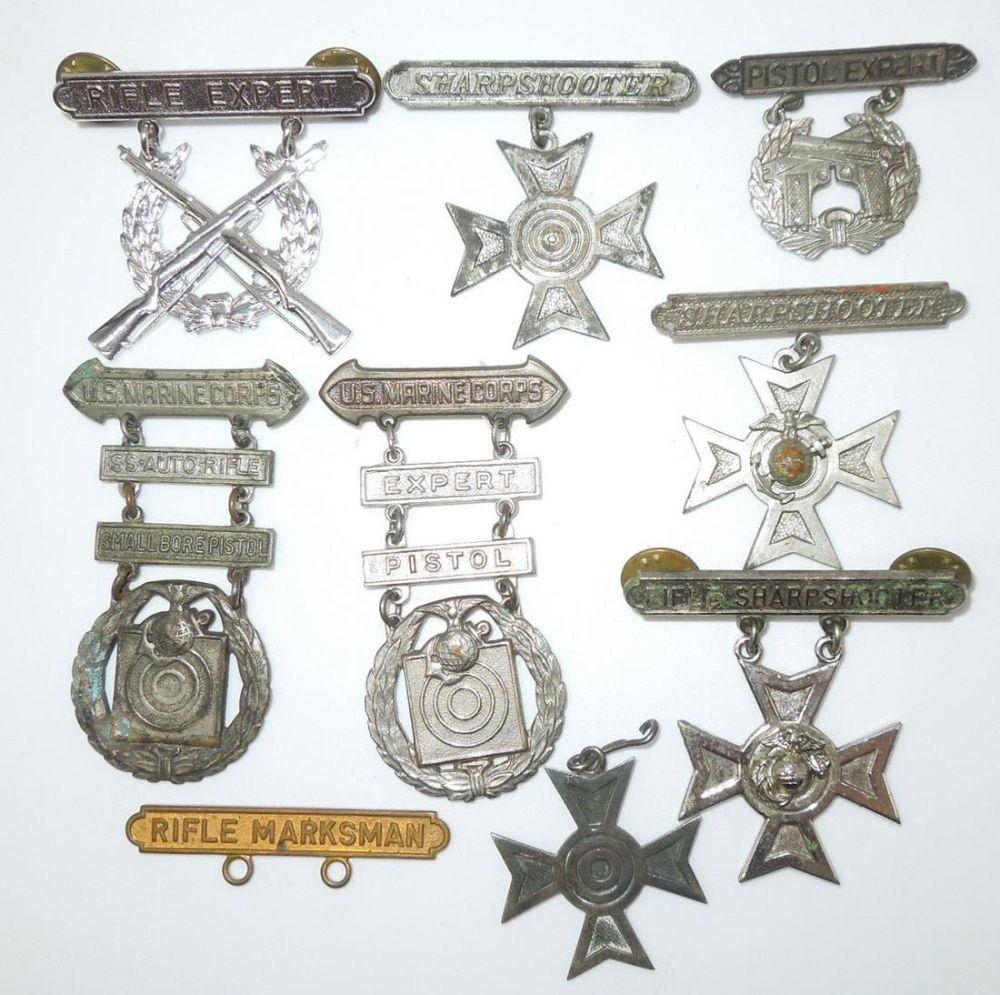 Lot 287: WWII - Vietnam USMC Marine Corps Marksmanship Shooting Badges