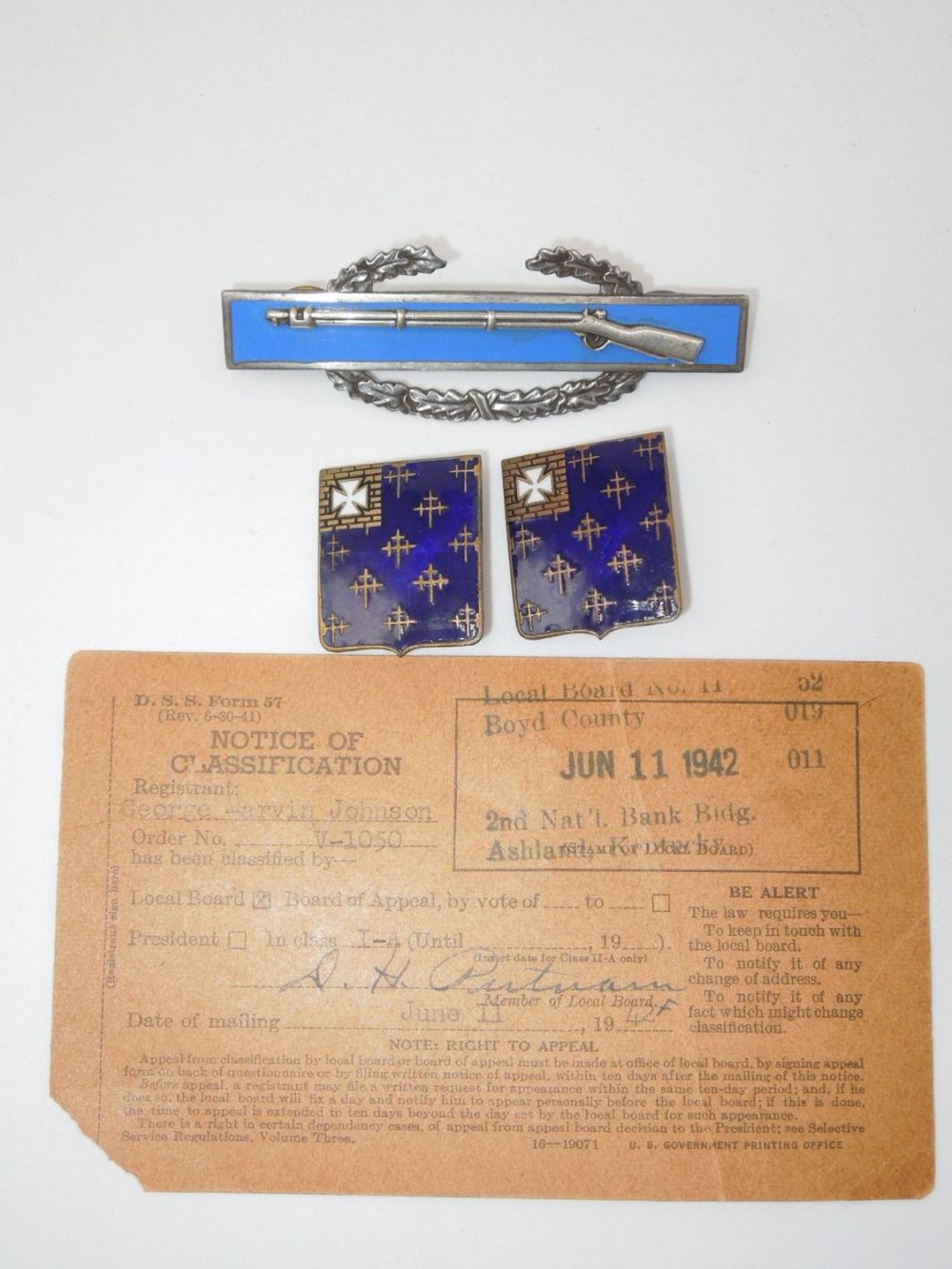 Lot 291: WWII Named US Army 34th Infantry Regiment Sterling CIB, DUI & Selective Service Lot