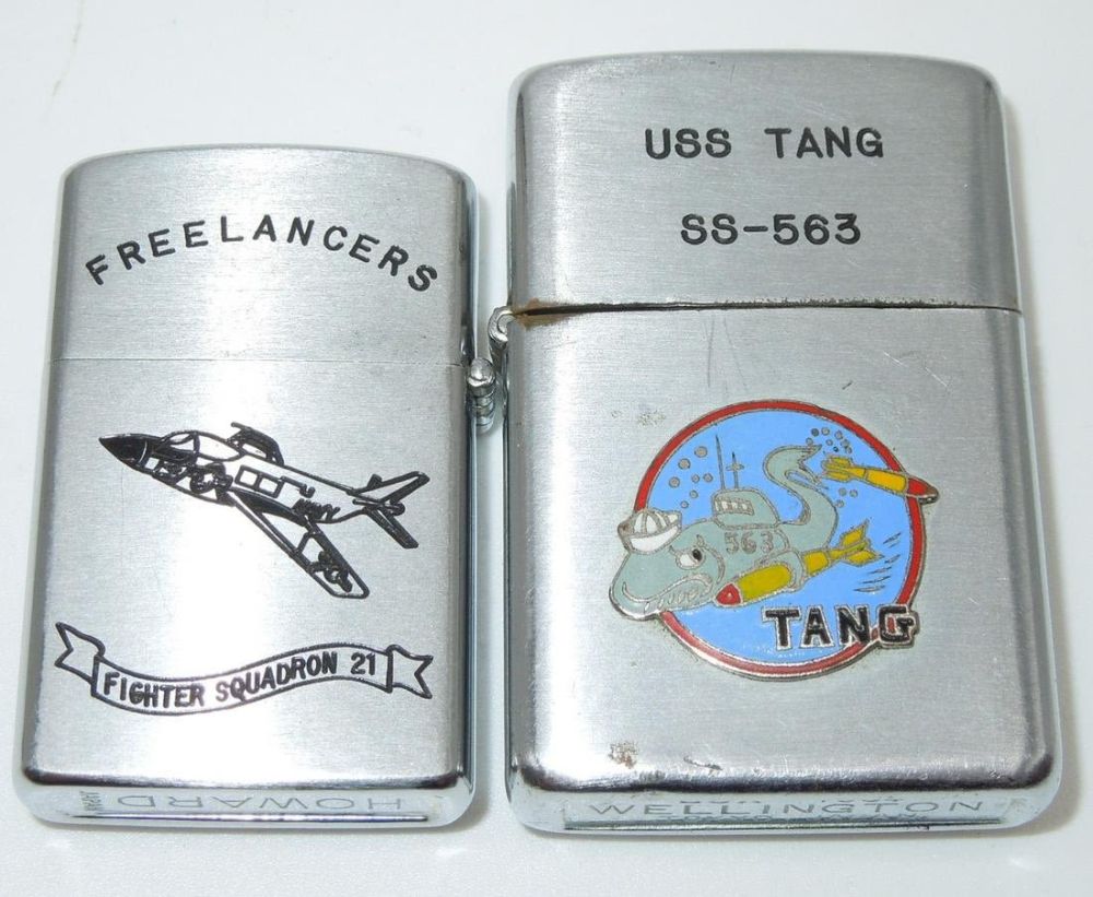 Lot 483: USAF Freelancers Fighter Squadron 21 Howard & USN USS Tang Submarine Lighters