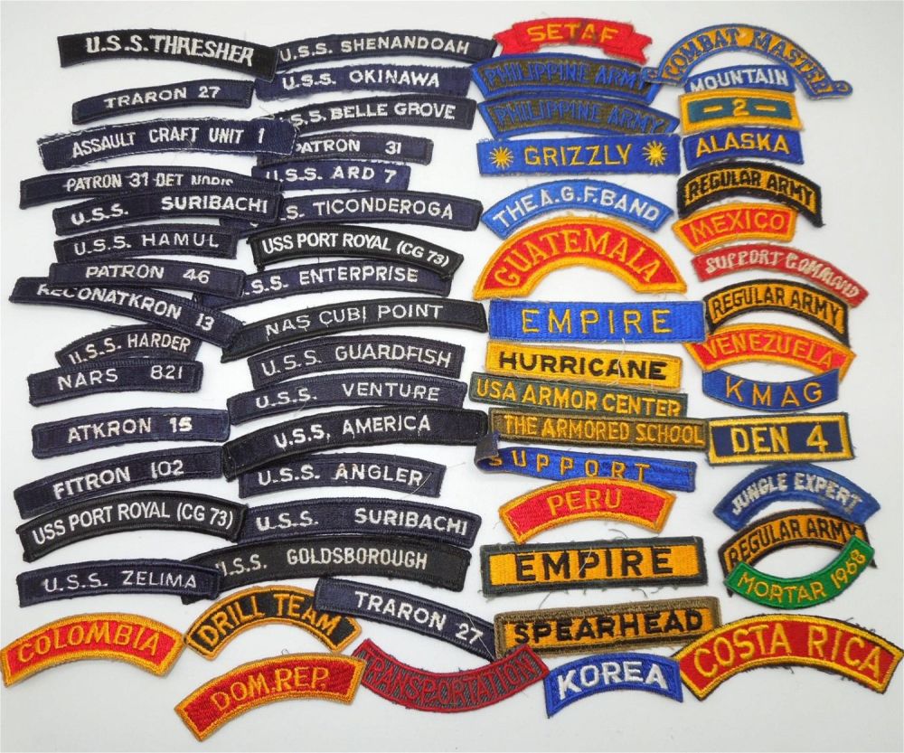 Lot 338: Huge Lot of WWII - Vietnam US Army & Navy Patch Tabs and Scrolls