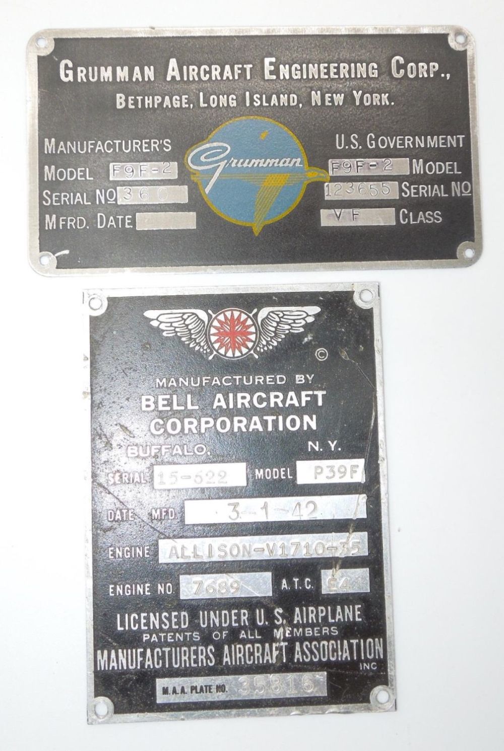 Lot 464: WWII & Korean War US Aircraft Data Plates Grumman F9F-2 & Bell P39-F Airacorba Fighters